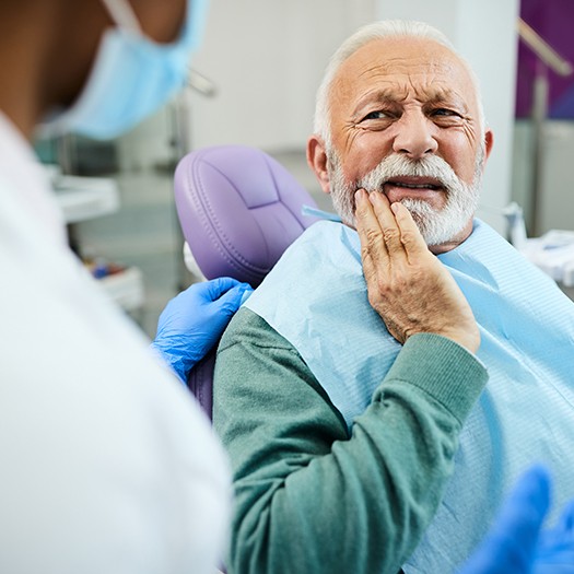 symptoms of dental implant failure include pain at the implant site